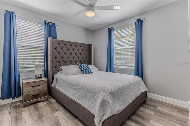 6183 Waverly Rd, Weeki Wachee, FL 34607 - bedroom with wood finished floors, baseboards, and a ceiling fan