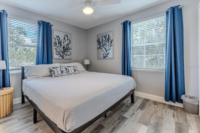 6183 Waverly Rd, Weeki Wachee, FL 34607 - bedroom with baseboards, light wood-style flooring, and ceiling fan