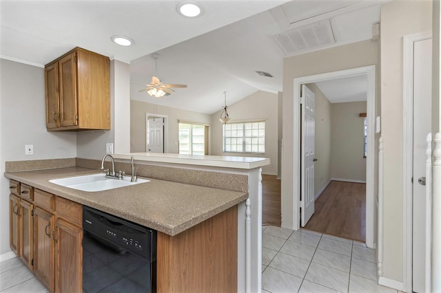 kitchen featuring visible vents, ceiling fan, dishwasher, brown cabinets, and a sink