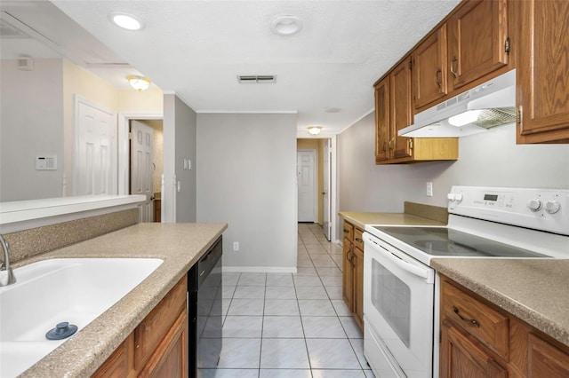 kitchen with electric range, brown cabinets, under cabinet range hood, a sink, and dishwasher