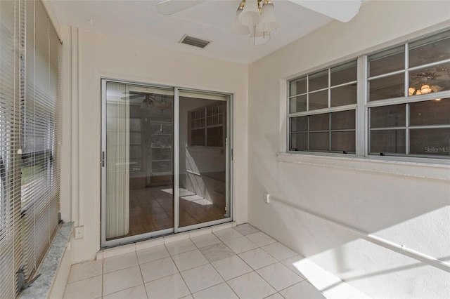 exterior space featuring visible vents, stucco siding, a patio, and ceiling fan