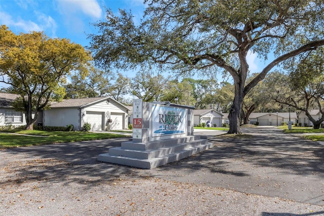 exterior space featuring aphalt driveway and a garage