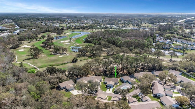 birds eye view of property featuring view of golf course, a water view, and a residential view