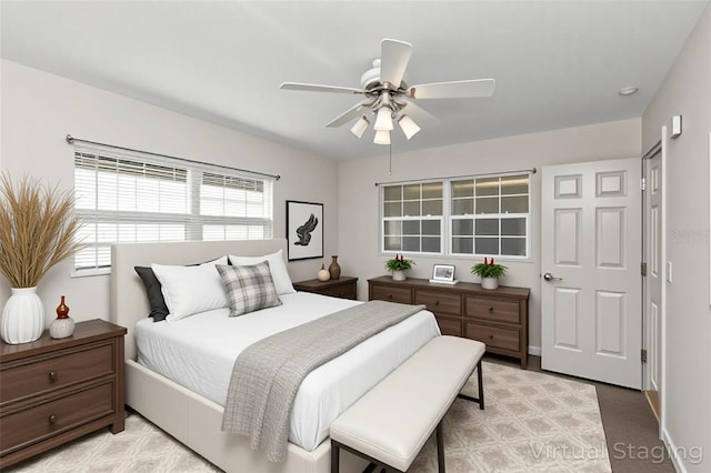 3806 River Oaks Ct, New Port Richey, FL 34655 - bedroom with a ceiling fan and baseboards