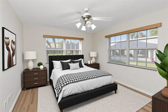 3806 River Oaks Ct, New Port Richey, FL 34655 - bedroom featuring light wood-style flooring, baseboards, and ceiling fan