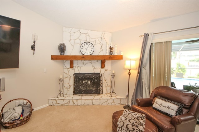 living room with carpet floors and a fireplace