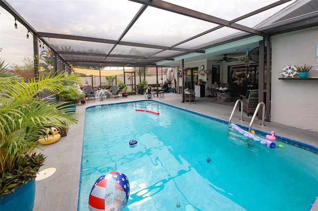 view of swimming pool with a patio area, glass enclosure, and a fenced in pool