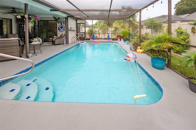 view of pool with a lanai, a fenced in pool, a ceiling fan, and a patio