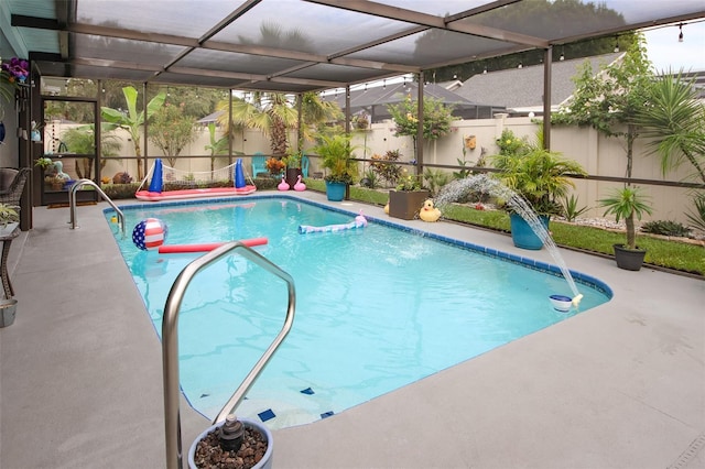 view of pool with a fenced in pool, glass enclosure, fence, and a patio