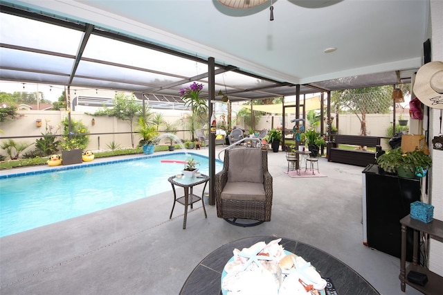 view of pool with a lanai, a fenced backyard, a fenced in pool, and a patio