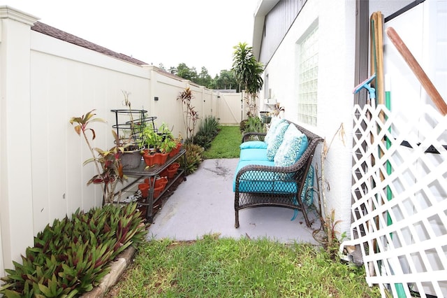 view of patio / terrace featuring fence