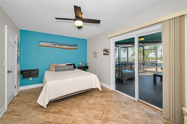 bedroom featuring baseboards, a ceiling fan, and access to exterior