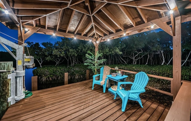 deck at night with a gazebo