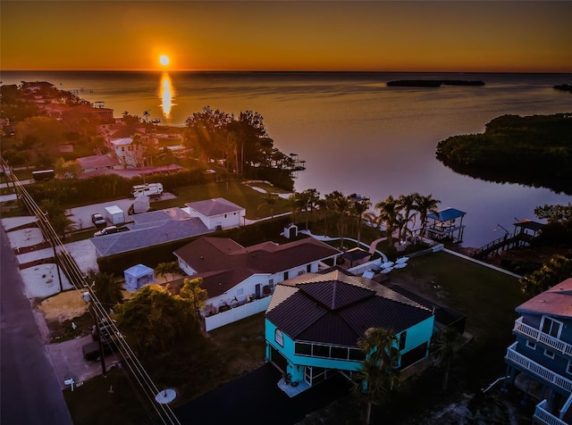 aerial view at dusk with a water view