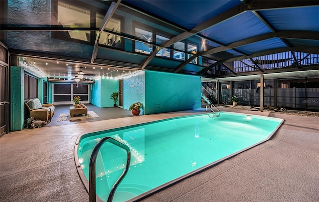 view of pool with a fenced in pool, a lanai, a patio area, and fence