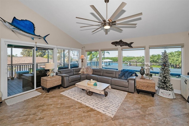 sunroom / solarium featuring lofted ceiling and ceiling fan