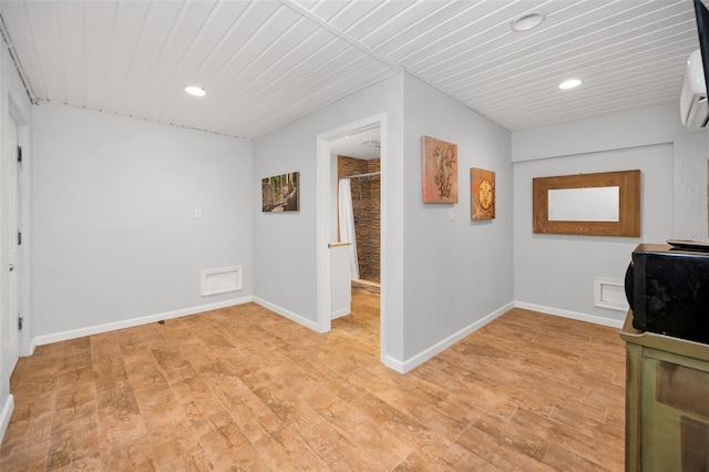 interior space featuring light wood-style floors, recessed lighting, and baseboards