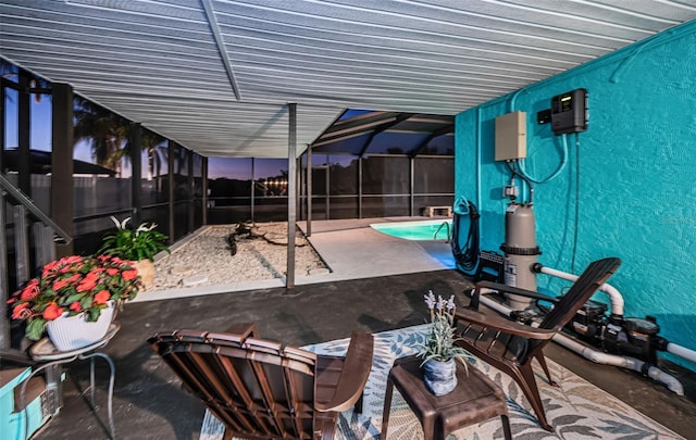 view of patio / terrace featuring glass enclosure and fence