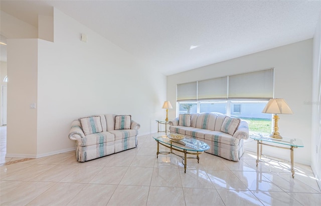 living area featuring tile patterned floors and baseboards