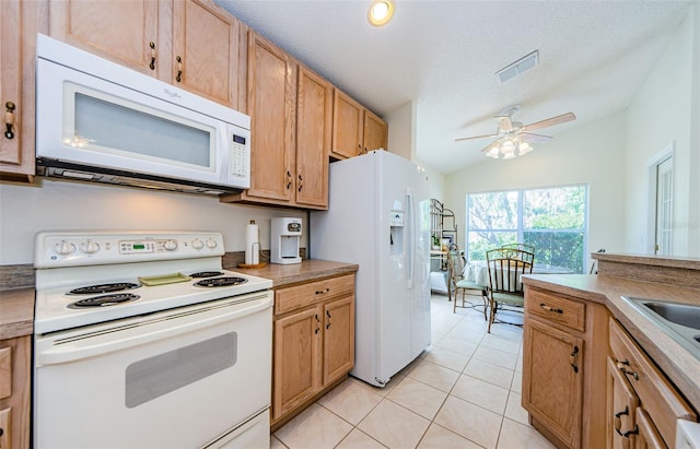 kitchen featuring visible vents, light tile patterned flooring, white appliances, a textured ceiling, and a ceiling fan