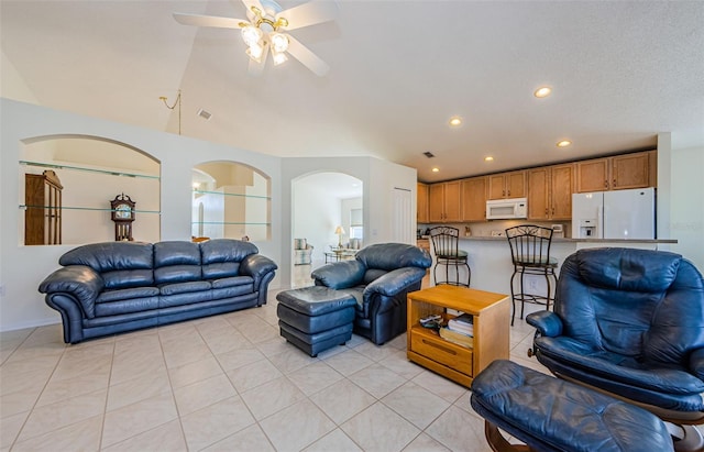 living room with lofted ceiling, recessed lighting, arched walkways, light tile patterned flooring, and a ceiling fan