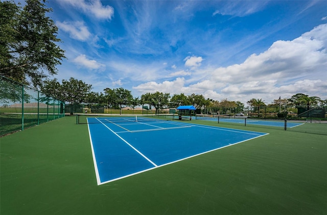 view of sport court with fence