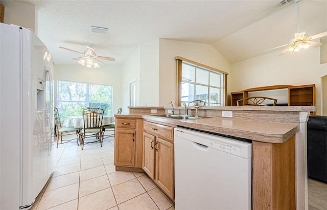 kitchen with white appliances, plenty of natural light, a ceiling fan, and visible vents