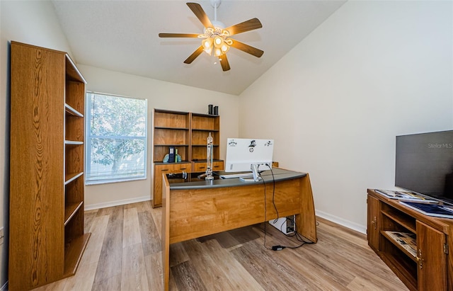 office area with baseboards, wood finished floors, ceiling fan, and vaulted ceiling