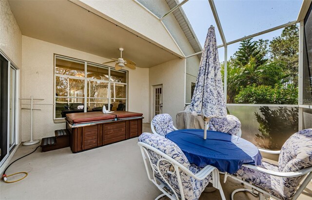 sunroom featuring a wealth of natural light and ceiling fan