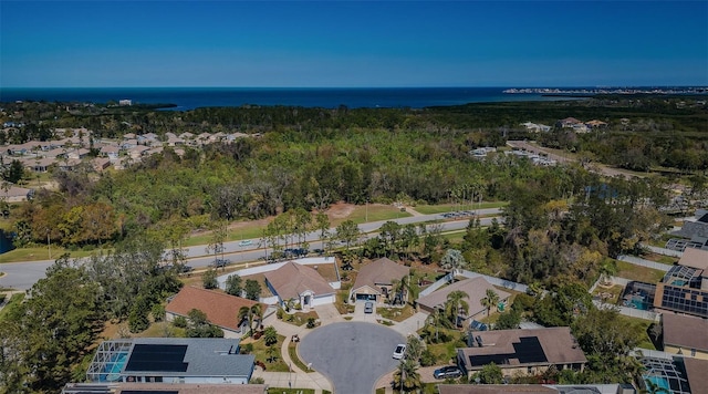 bird's eye view with a residential view and a water view