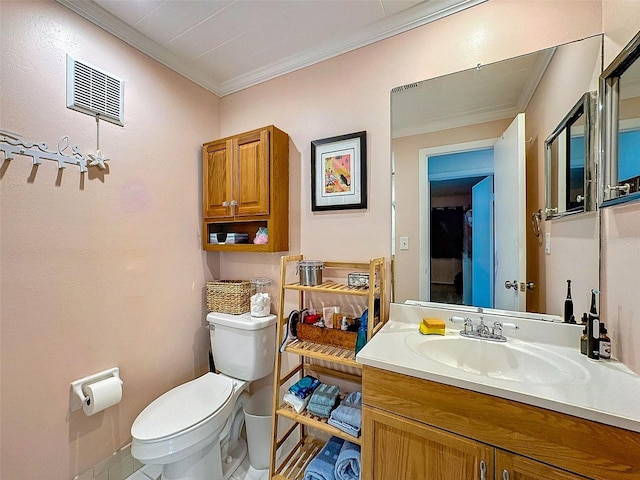 bathroom with toilet, visible vents, ornamental molding, and vanity