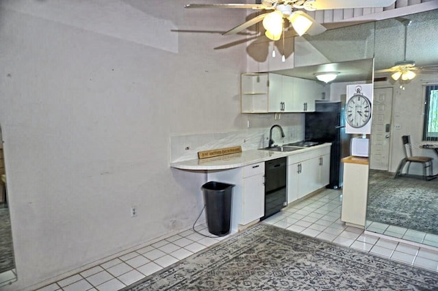 kitchen featuring black appliances, white cabinets, light countertops, and light tile patterned flooring