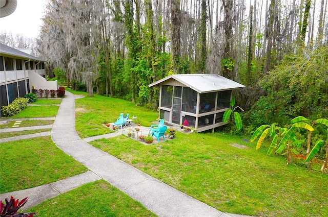 view of yard with a sunroom