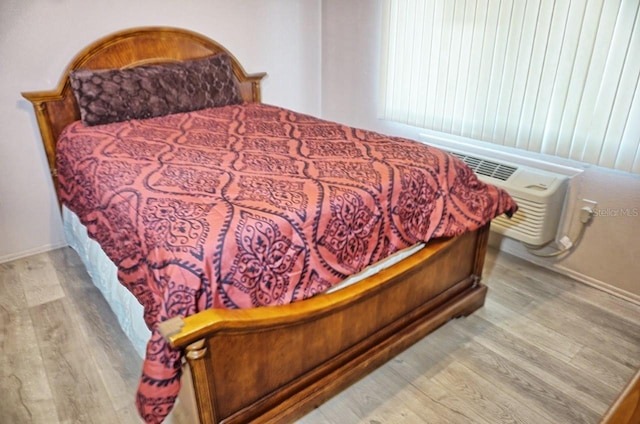 bedroom featuring wood finished floors