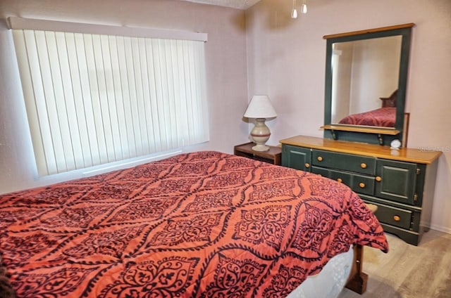 bedroom with wood finished floors