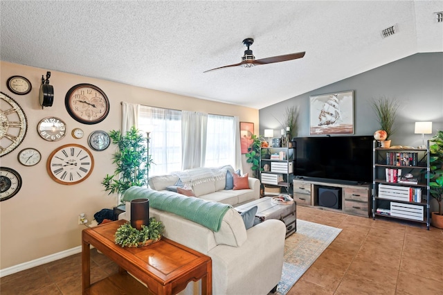 tiled living room featuring baseboards, visible vents, a ceiling fan, lofted ceiling, and a textured ceiling