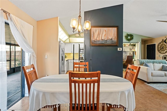 dining area featuring vaulted ceiling, light tile patterned flooring, and a notable chandelier