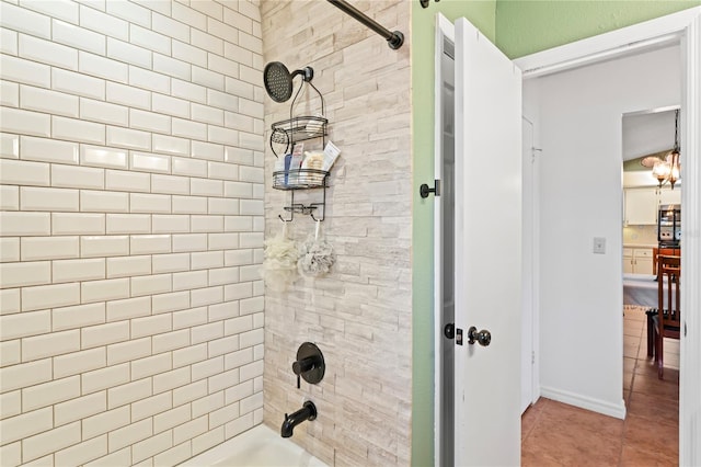 bathroom featuring shower / washtub combination and tile patterned floors