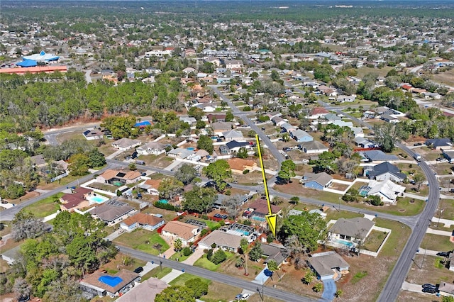 birds eye view of property with a residential view