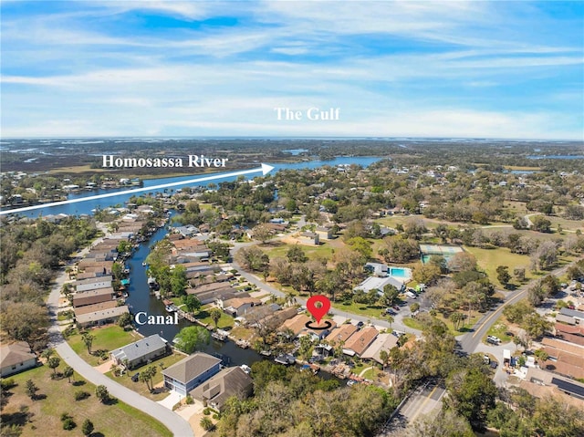 birds eye view of property with a water view and a residential view