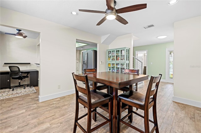 dining room with recessed lighting, a ceiling fan, baseboards, visible vents, and light wood-style floors