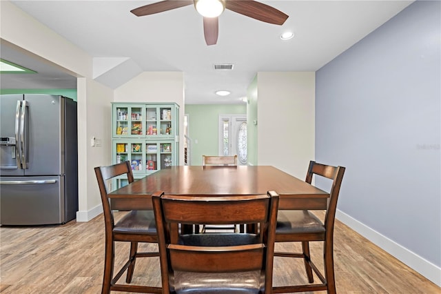 dining room with light wood-type flooring, visible vents, baseboards, and recessed lighting