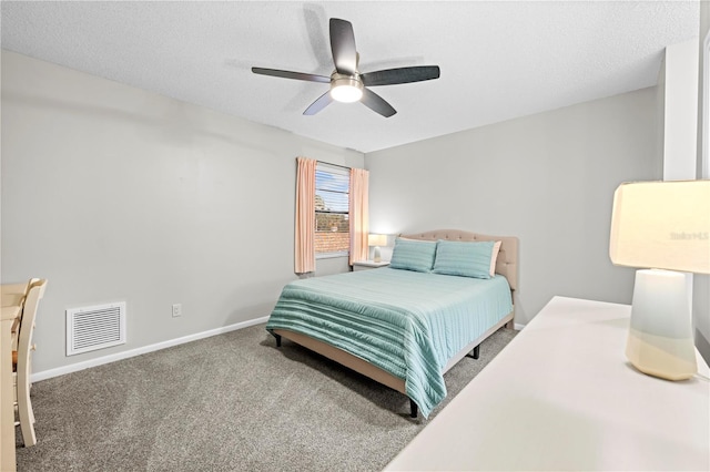 bedroom featuring carpet floors, visible vents, ceiling fan, a textured ceiling, and baseboards