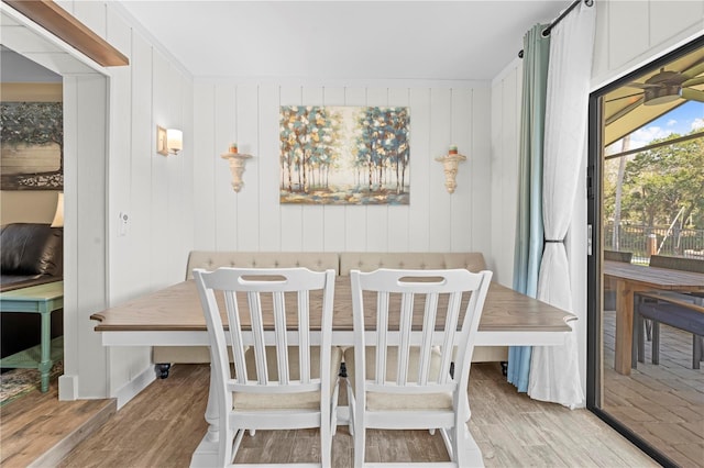 dining space featuring light wood finished floors