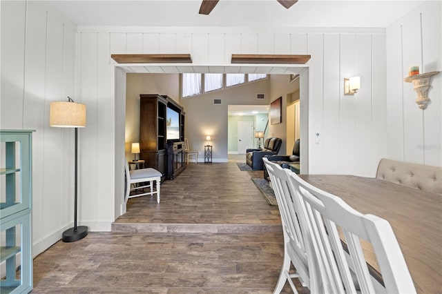 dining area featuring lofted ceiling with beams, visible vents, a ceiling fan, and wood finished floors