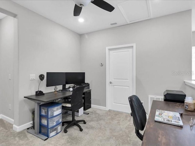 office featuring ceiling fan, carpet floors, visible vents, and baseboards