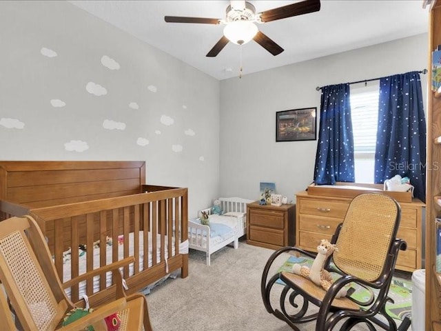 carpeted bedroom with ceiling fan