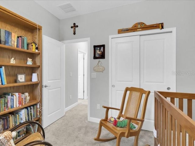 living area featuring light carpet, visible vents, and baseboards