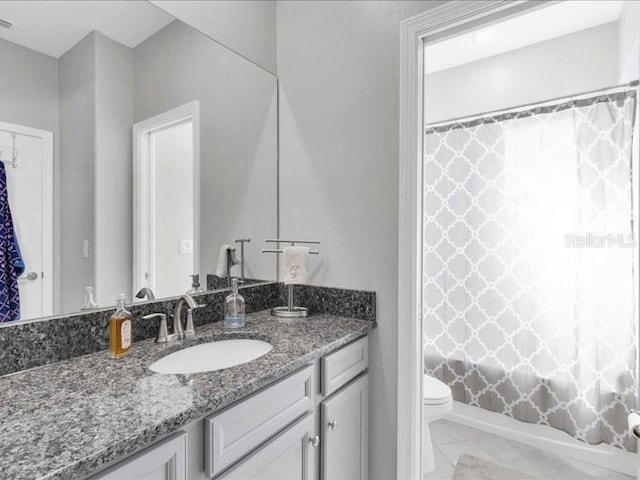 full bathroom featuring toilet, visible vents, and vanity