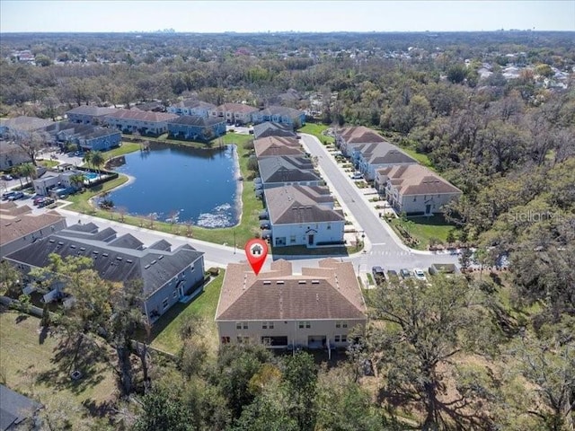 drone / aerial view featuring a water view and a residential view